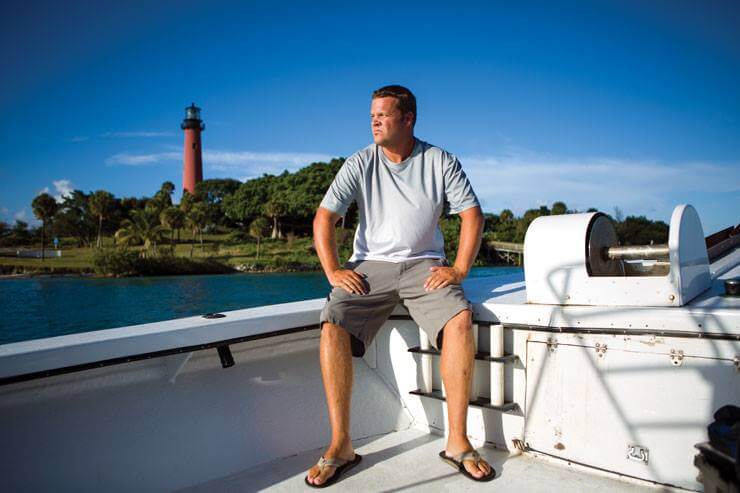 An image of our owner/founder and experienced shark diving professional Captain Bryce Rohrer on the boat in Jupiter Florida.
