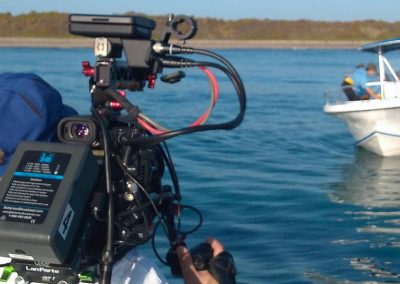 Image of a film crew filming aboard a Florida Shark Diving excursion.
