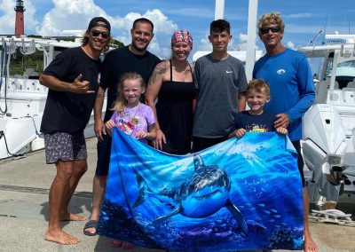 An image of the FLorida Shark Diving team at the dock with guests for a Florida Shark tour.